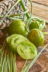 Green Heirloom Tomato on barnboards farm to table