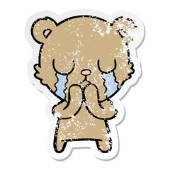 distressed sticker of a crying cartoon bear