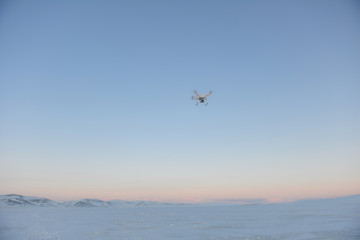 Fototapeta na wymiar drone quadrocopter hovering in the sky