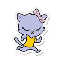 sticker of a cute cartoon cat with bow