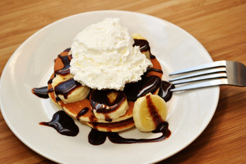 Banana Pancakes with Chocolate Sauce and Ice Cream