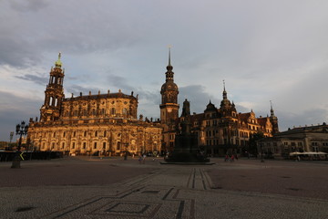 Fototapeta premium Sun lit architecture in Dresden, Germany. View of the Theater Platz and the Roman Catholic Cathedral (Katholische Hofkirche) in the background.