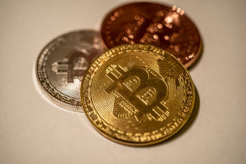 bitcoin cryptocurrency on white background close up - selective focus