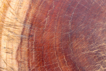 Brown dark scratched wooden cutting, chopping board. Wood texture.