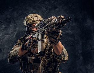 Private security service contractors, the elite special unit, full protective soldier holding...