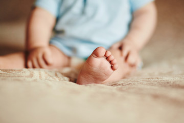 the feet of a small child. Newborn's little fingers. cute little baby feet