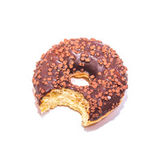 Bitten chocolate donut on white background