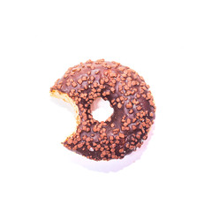 Bitten chocolate donut on white background