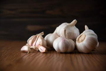 Garlic bulb on the wooden vintage background