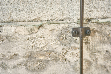 thunderhead from a copper wire on a stone wall 