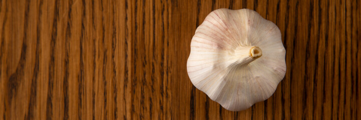 Garlic bulb on the wooden vintage background