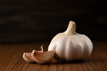 Garlic bulb on the wooden vintage background