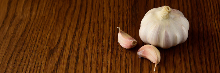 Garlic bulb on the wooden vintage background