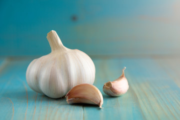 Garlic bulb on the wooden vintage background