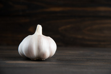 Garlic bulb on the wooden vintage background