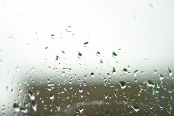 Fresh weather outside the window after the rain with drops on the window. rainy nature of autumn and summer days. Cool spring conditions. Stock photos