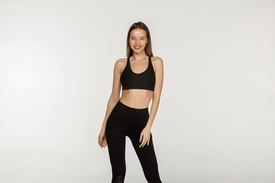 Young Slim Girl In A Black Tight Suit For Yoga And Fitness Stock Photo,  Picture and Royalty Free Image. Image 118631819.