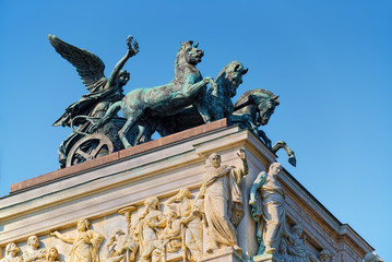 Allegoric sculptural decor on the roof of building of Austrian Parliament, in Vienna.