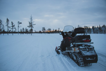 snowmobile in the wilderness of finnish lappland