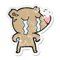 distressed sticker of a cartoon crying bear
