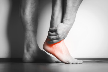 man with pain in foot