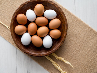 Spring and Easter holiday concept. Easter eggs painted blue and white, pastel color background. Isolated on white.