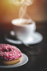 Pink donut with white sprinkle