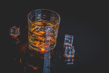 Whisky, whiskey or bourbon with ice