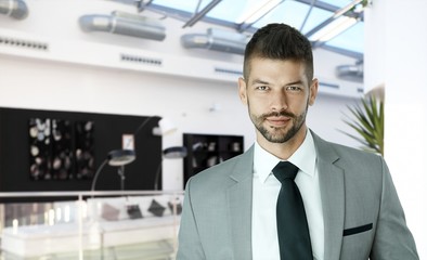 Handsome and confident businessman in suit