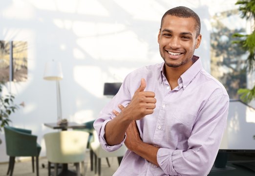 Happy afro-american businessman showing thumb up
