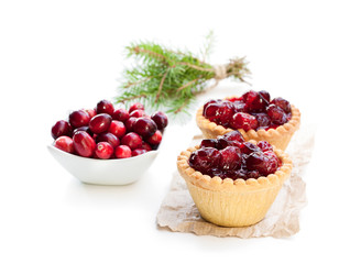 egg custard tarts with cranberry jam isolated on white