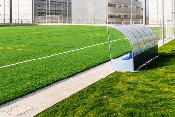 Soccer bench of a soccer court with artificial turf