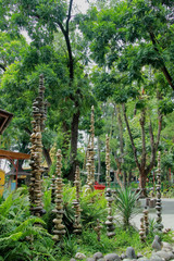 Fototapeta premium tall balanced stone pyramide on gembiraloka zoo