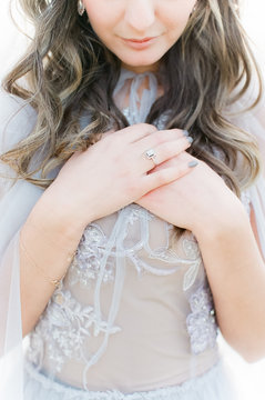 Woman wears grey sequined gown