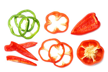 cut slices of red and green sweet bell pepper isolated on white background top view