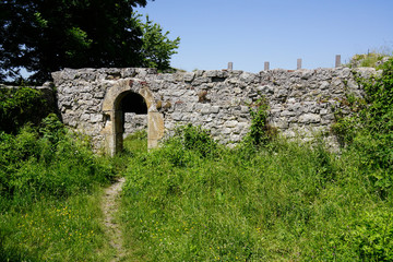 foot path to gate of castle ruin wall