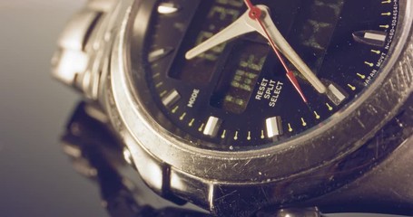 Macro footage of a hand watch with the seconds hand ticking
