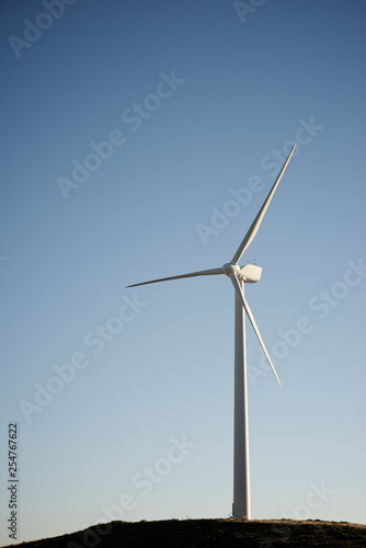 Windmill In Field Against Clear Sky Stock Photo And Royalty