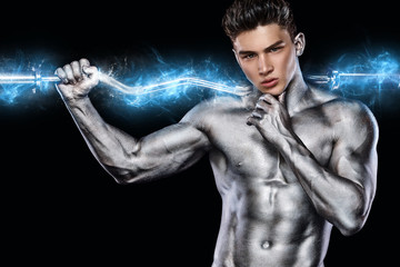 Brutal strong muscular bodybuilder athletic man pumping up muscles with barbell on black background. Workout bodybuilding concept. Copy space for sport nutrition ads.