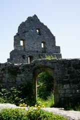 gate and building facade grey stone castle ruin