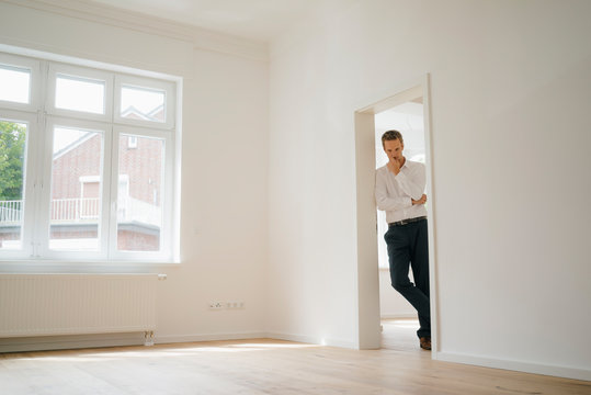 Mid adult man viewing newly refurbished flat