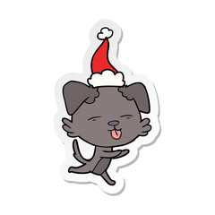 sticker cartoon of a dog sticking out tongue wearing santa hat