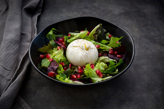 Oriental salad with mint, pistachios, pomegranate seeds and burrata cheese