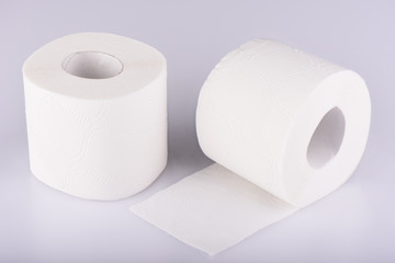 Two rolls of white toilet paper isolated. The paper product used in the sanitary and hygienic purposes.