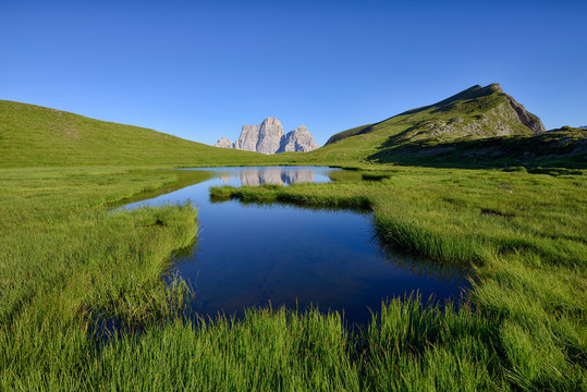 Italy, Province of Belluno, Dolomites, Selva di Cadore, Monte Pelmo reflecting in Lago delle Baste