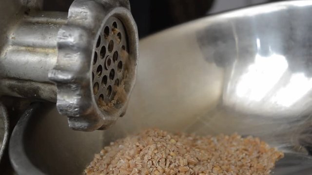In the kitchen threshing grain