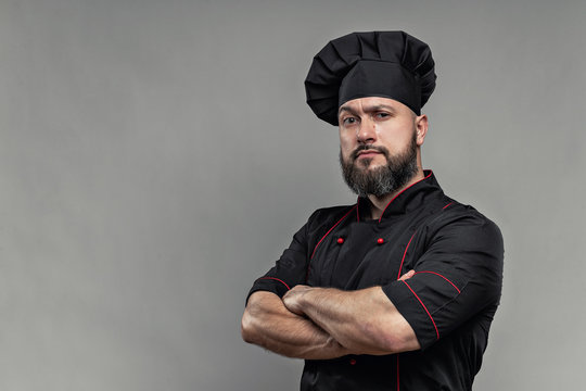 chef in black jacket with beard