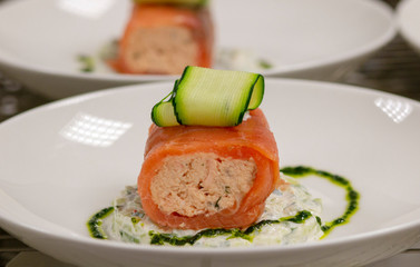red fish roll with greens and sauce