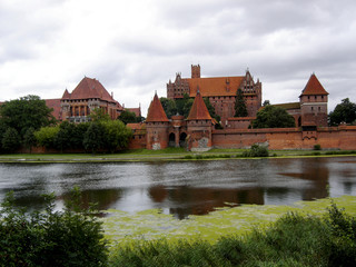 Fototapeta na wymiar Landscape. Malbork Castle in Poland, view across the Nogat river.