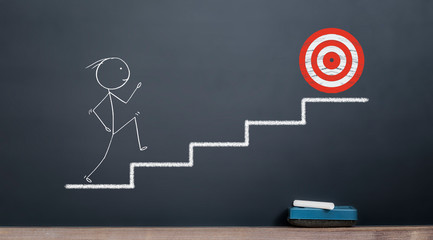 stickman going out of stairs to reach red target. success and target concept on blackboard